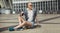 High fashion look. glamour joyful beautiful young blond girl in summer bright casual hipster clothes sitting on a little