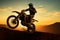 High flying motocross Front wheel raised in silhouette, an action spectacle