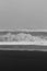 High foamy waves on beach monochrome landscape photo