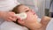 High frequency skin treatment of female face in spa