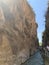 A high gorge of rocks and a mountain river. Deep narrow canyon along the river. Sights of Turkey, excursion for tourists.