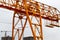 High heavy yellow metal iron load-bearing construction stationary industrial powerful gantry crane of bridge type on supports