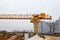 High heavy yellow metal iron load-bearing construction stationary industrial powerful gantry crane of bridge type on supports