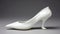 High Heel White Shoe: American Sculpture Style On Flat Surface