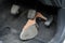 High-heeled shoe stuck under brake