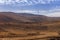 High hill landscape with wind turbines