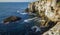 High inaccessible coastal cliffs made of shell rock near the village of Tyulenovo, southern Bulgaria