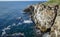 High inaccessible coastal cliffs made of shell rock near the village of Tyulenovo, southern Bulgaria