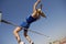 High Jumper In Midair Over Bar