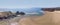 A high level aerial panorama view across the Three Cliffs Bay, Gower Peninsula, Swansea, South Wales