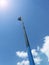 High long industrial crane arm on blue sky,heaven,