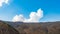 High majestic cliffs and blue sky with clouds