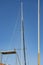 High masts sailing yacht against a blue sky.