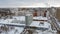 High modern living building covered snow in winter day in city, top view