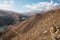 High mountain landscape of the North Caucasus. A snapshot from the height of a lake and a dirt road on a background