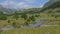 High mountain overview, with stone pine and flowing river