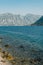 High mountain range in a light haze at the foot of the sea