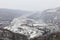 High-mountain, suspended rope bridge, which offers stunning views of the gorge, which runs a mountain river and a view of the vill