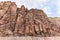 High mountains along the edges of the gorge along the hiking route along the Wadi Numeira gorge in Jordan