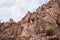 High mountains along the edges of gorge along the hiking route along the Wadi Numeira gorge in Jordan