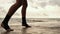 High pace video: female boxer`s legs moving on during the training. Woman is training by the beach. Closeup on legs