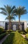 High Palm Trees And Old Wooden Arch In Egypt. Middle East Architecture And Ornamental Garden In Resort City, Green Bushes