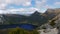 High panning shot of dove lake and cradle mountain from marion`s lookout