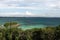 High panoramic point of view looking over the turquoise tropical ocean horizon.
