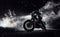 High power motorcycle chopper with man rider at night