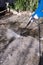High pressure washer cleaning backyard or driveway concrete paving, DIY and home improvement