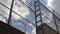 High prison fence with barbed wire against the blue sky. camera rises slowly up