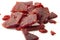 High protein diet and food that is high in sodium and salt concept theme with close up on beef jerky meat strips isolated on white