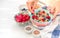 High protein healthy breakfast, buckwheat porridge with blueberries, raspberries, flax seeds and honey Closeup view, selective foc