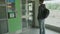 High quality 4k video of a young man who is waiting for elevator on the parking lot or station.