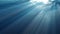 High quality Looping animation of ocean waves from realistic underwater. Light rays shining through