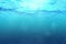 High quality perfectly seamless loop of deep blue ocean waves from underwater background with micro particles flowing