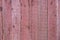 high quality photo of a red painted texture background made from raw wood planks