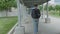 High quality picture of a young men who is walking outside on the street to to from parking lot on the train station.