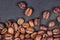 High quality roasted coffee beans on a dark background, top view