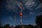 High radio tower at night