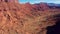 High Red Rock Butte Formation In Colorado Desert Valley Aerial Shot Bottom Up