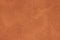 High res close up grunge rough dark orange colored stucco wall