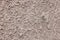 High res close up rough unfinished weathered pale dark gray cream cement wall