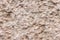 High res extreme close up grunge crowded textured unfinished pale beige concrete wall