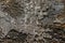 High res intense close up of abstract modern painting art of dark earth tones with thick silver splashes texture background