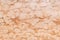 high res Intense rough and grunge pale salmon pink shaded stone wall texture background