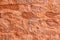 high res Intense rough and grunge pale salmon pink shaded stone wall texture background close up