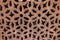 High res intricate arabesque relief decorated pale rough wood wall detail in Cairo, Egypt