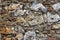 high res of old grunge rough calcareous tuff irregular blocks brown and gray stones wall texture close up background