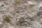 high res of old grunge and rough calcareous tuff large block gray stone wall texture close up background